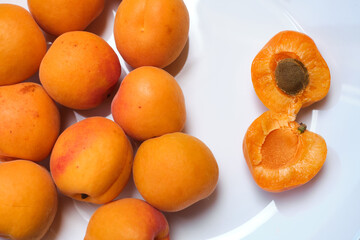 Fresh sweet apricots on a light background. Vegetable food. fresh vitamins. Organic eco product, farm. Without GMO