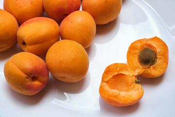 Fresh sweet apricots on a light background. Vegetable food. fresh vitamins. Organic eco product, farm. Without GMO
