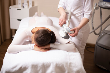 Frame photo of a massage and body care - woman getting spa massage treatment at beauty spa salon.