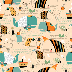 Seamless Pattern with Cartoon Funny Whales wearing Sweaters © Maria Starus