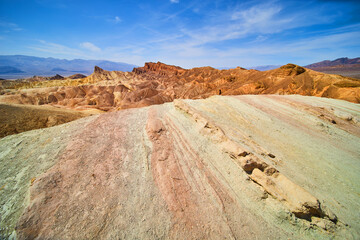 Waves of colorful rock and sediment in Death Valley mountains