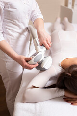 Cropped view of a young woman having anti cellulite massag treatment at beauty spa salon - cellulite problem concept