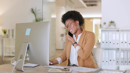 Black secretary booking appointment, checking stock and ordering supplies while talking on a phone in a modern office. African American female doing inventory and responding to emails on a desktop