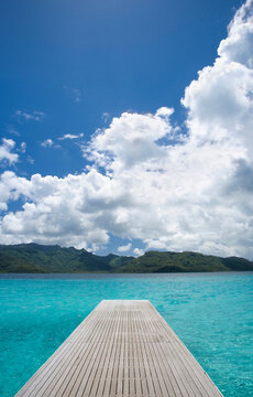 Boat dock off the island of Tahiti at luxury resort