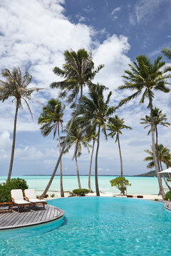 Pool on the beach on luxury island resort in Tahiti 
