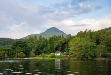 Landscape photography of lake, house, forest, mountain