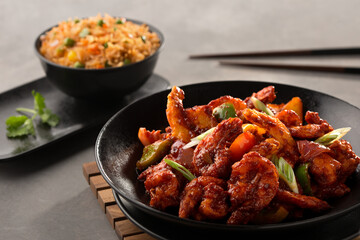 shanghai prawn with fried rice served in dish isolated on dark background side view