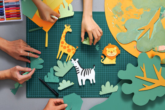 Giraffe, zebra, lion made from paper in art project