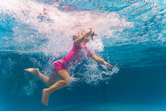 baby girl swimming in the pool