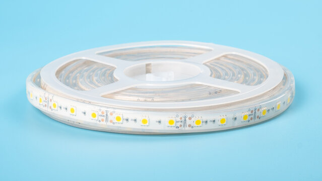led strip on blue background, coil of diode light.