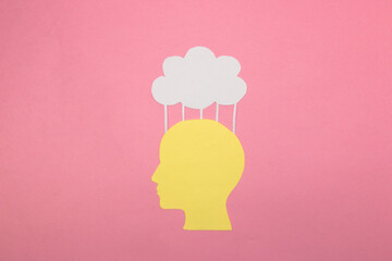yellow paper people head that uploads content to the cloud, creative art design, artificial...