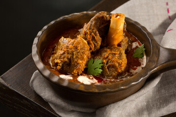Nalli nihari served in dish isolated on dark background side view