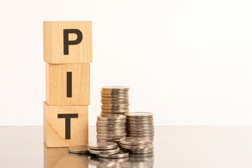 Column of cubes with abbreviation PIT cubes and coins reflected