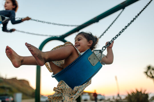 Sisters on swings