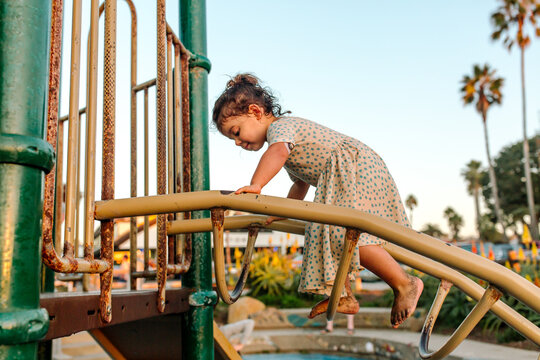 Young girl climbing at playground