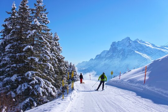snow covered ski slopes in snowy winter in Swiss Alps