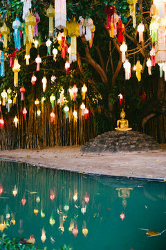 A golden Buddha statue in a temple in Thailand