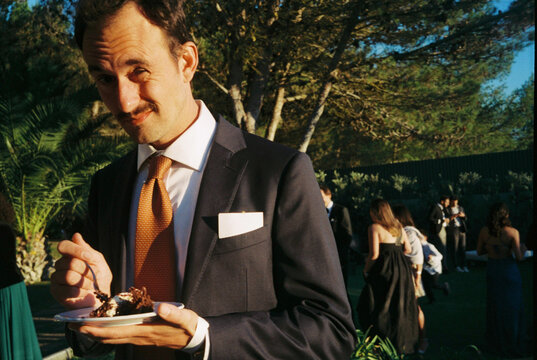 Wedding cake candid guest portrait