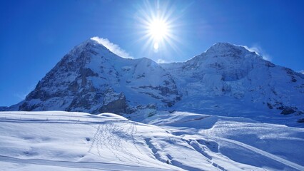 snow covered ski slopes in snowy winter in Swiss Alps