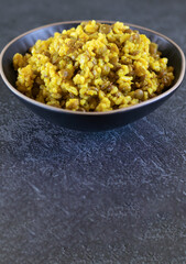 Mujadara made of lentils and rise on a dark background with copy space