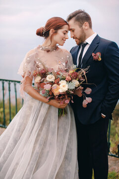 Portrait Of Loving Couple With Flowers