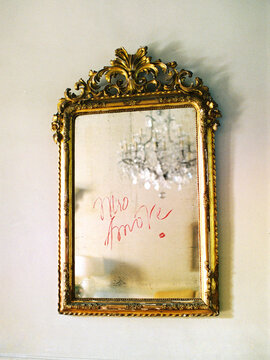 Reflecting Chandelier In The Mirror