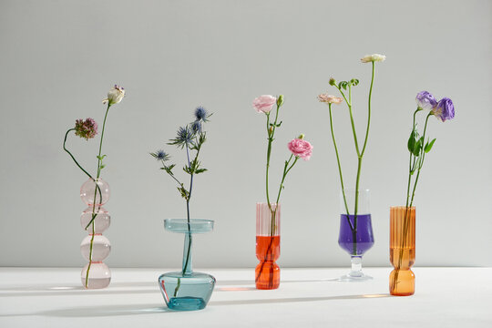 Glass vases with beautiful bouquets of fresh flowers