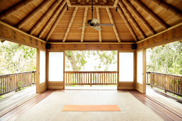 Yoga mat in empty Japanese yoga deck at luxury home
