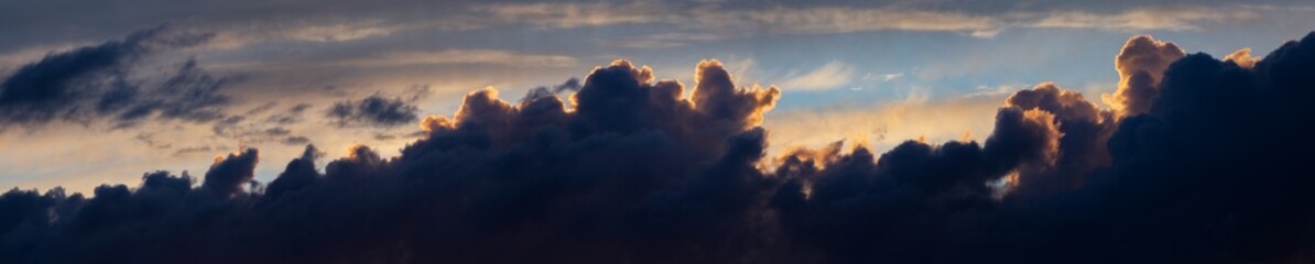 Sky panorama. Beautiful dramatic big clouds in the sky. Landscape of the power of heaven and nature. Copy space