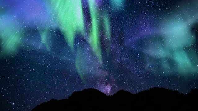 Aurora Purple  Green and Milky Way Galaxy Mountains Tilt Up