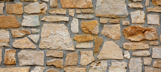 Texture of a stone wall. Old castle stone wall texture background. Banner