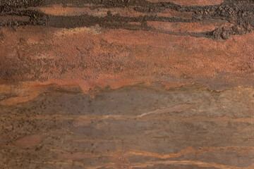 Brown rusty metal surface with dark traces of fuel oil old steel texture industrial background