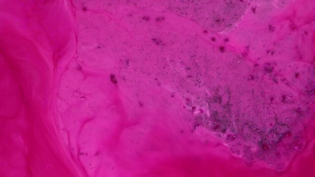 Abstract grunge fluid art background. Swirling purple and pink paint