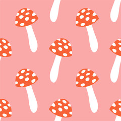 Mushrooms seamless pattern. Fly agaric texture design for textile, wrapping paper. Magic wonderful mushroom background. Vector illustration on a pink background.