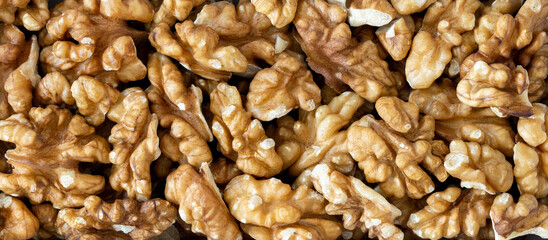 Pile of walnut kernels, close-up, top view, macro.
