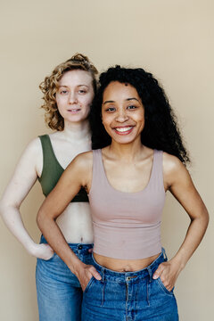 Multiracial women looking at camera