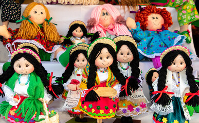 Handicraft souvenir dolls in traditional clothes for Cuenca city and Azuay province, Ecuador.	