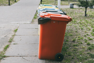 Fototapeta na wymiar Multicolored trash cans. Garbage sorting