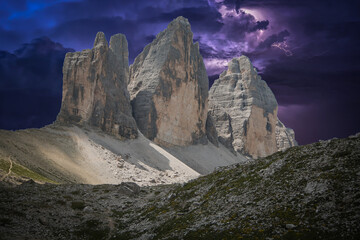 Dark view of Tre Cime di Lavaredo with summer storm in Alto Adige Italy - obrazy, fototapety, plakaty