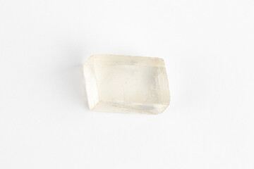 Icelandic Spar Crystal on White Background. Calcite. Viking Sunstone