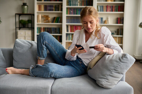 Woman making online purchases on smartphone