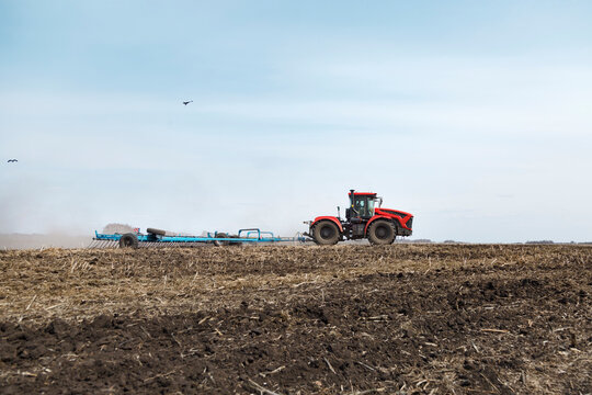 Agricultural machine working on field in daytime