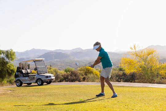Morning Golf backswing  for Athletic Senior Citizen Woman  