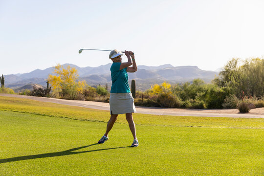 Early Morning Golf course swing  for Athletic  Woman  