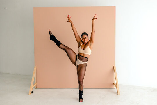 High kick by woman with thong over fishnets