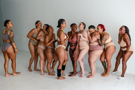 Ten happy women in underwear