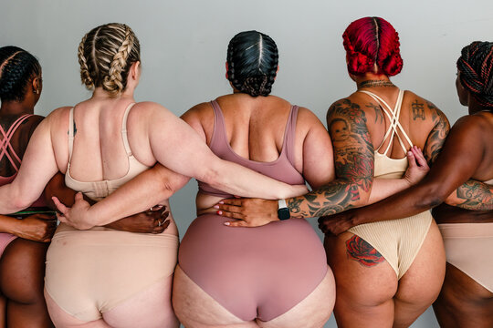 Back view of curvy women in underwear