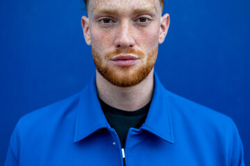 Redhead bearded man looking at camera