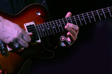 Naklejka na ściany i meble Guitarist Plays With Finger Slide