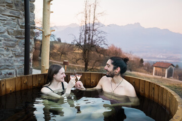 Couple Having Aperitif in Hot Tub